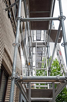 construction of steel scaffolding near building for renovation work,vertical scaffolding forms various grids,modern