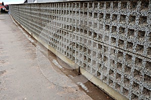 construction of a steep staircase by the stone wall car park with high