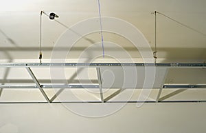 Construction of the structure of a suspended ceiling photo