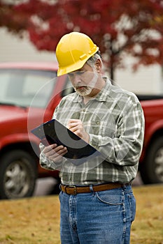 Construction Supervisor With Clipboard