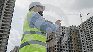 Construction Supervisor Inspecting Site