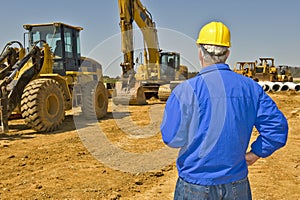 Construction Supervisor Overlooking Job Site