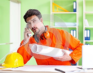 Construction supervisor planning new project in office