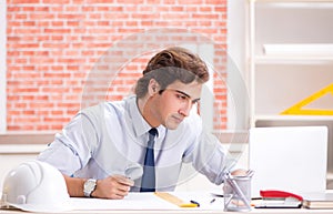 Construction supervisor working on blueprints