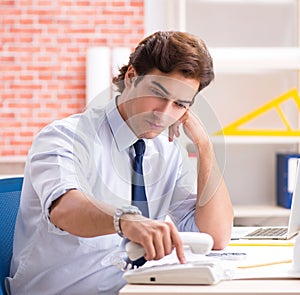 Construction supervisor working on blueprints