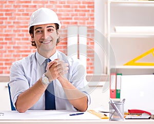 Construction supervisor working on blueprints