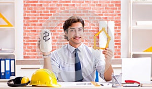 Construction supervisor working on blueprints