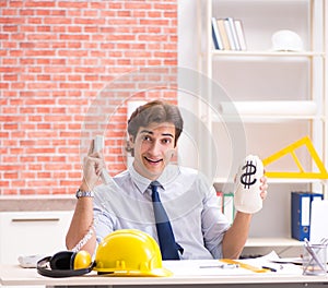 Construction supervisor working on blueprints