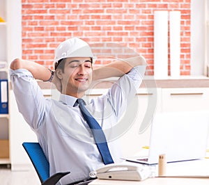 Construction supervisor working on blueprints