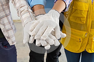 Construction Team Handshake or Join Hand of People
