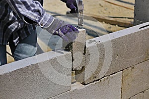 Construction technicians are building brick walls with lightweight bricks
