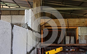 Construction technicians are making brick walls with cement