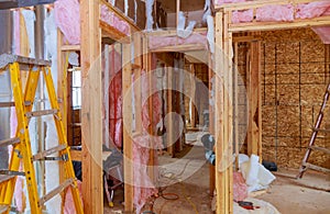 Construction thermally insulating wood frame house with wood fiber plates and heat isolating