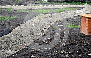 Construction of a threshing gravel sidewalk, installation of a steel strip as a curb path. between them there is a gravel mixture