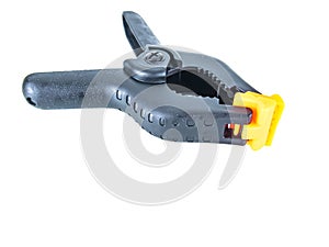 Construction tool black plastic clothespin on a white background