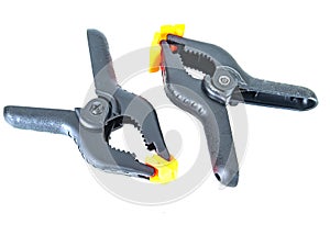 Construction tool black plastic clothespin on a white background