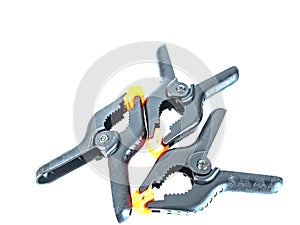 Construction tool black plastic clothespin on a white background