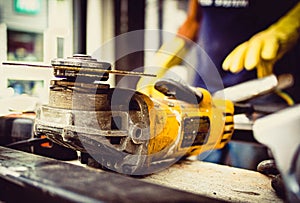 construction tool with man behind welding photo