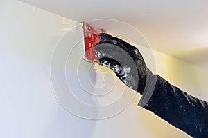 Construction tool for working contractor user in corner paint edger brush painter hands in the painting the wall