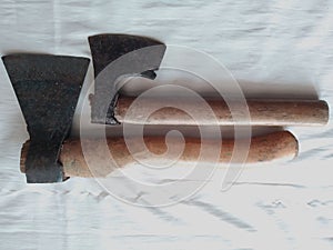 Construction tools, 2 small axes with wooden handles, a white background