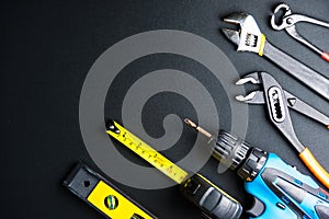Construction tools on Gray-black cement floor background with copy space.Home Repair concept, Repair maintenance concept,