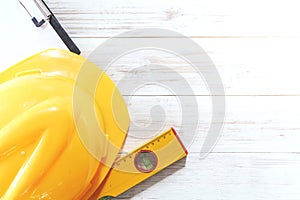 Construction tools with helmet safety on wooden background
