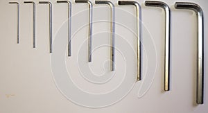 Hexagonal key on a white background. Copy space