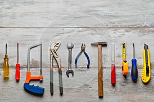 Construction tools on rustic wooden photo
