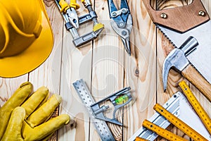 Construction tools set on wooden background