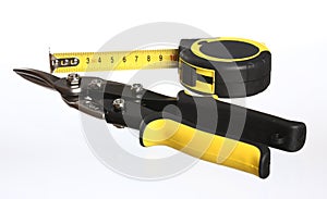 Construction tools: snips and tape measure