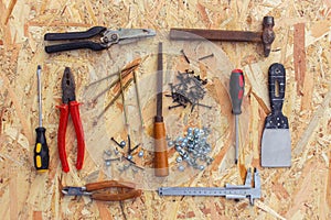 Construction tools on wooden background.