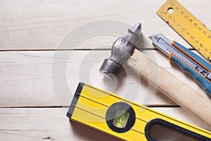 Construction tools on wooden background. Copy space for text. Set of assorted work tools. Top view