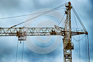 Construction. Tower crane. The process of building residential buildings.