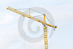 tower cranes against blue sky background