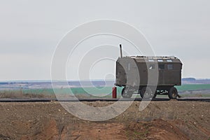 Construction Trailer on road construction work - industrial equipment among fields