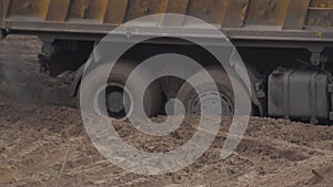 A construction truck stalled in the sand. Center differential lock, background, industry. Wheel grip