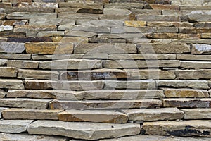 Construction of the wall of natural stone.