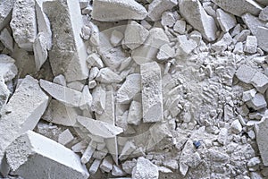 Construction waste debris - remains of white aac - autoclaved aerated concrete brick blocks, closeup detail