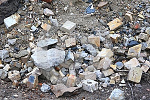 Construction waste with elements of various dismantled and destroyed old structures at landfill
