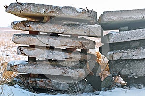 Construction waste in the field, the wreckage of concrete slabs in nature