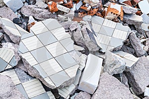 Building debris heap from broken tiles, bricks and concrete photo