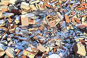 Construction waste with various dismantled and destroyed old structures at municipal landfill