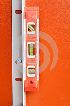 Construction Water Level on orange wall