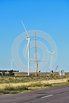 Construction of windmill with crane, seen from the route