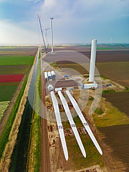 Construction of a windmill next to tulip fields in the netherlands
