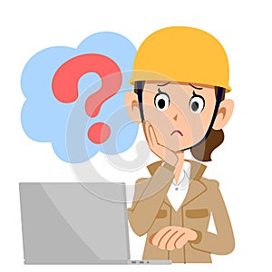 A construction woman who operates a computer with doubt beige clothes