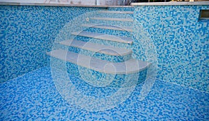 Construction work on an old swimming pool, bisazza mosaic