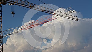 Construction work, two cranes that cross each other