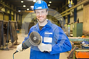 Construction worker with angle grinder