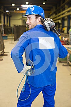 Construction worker with angle grinder